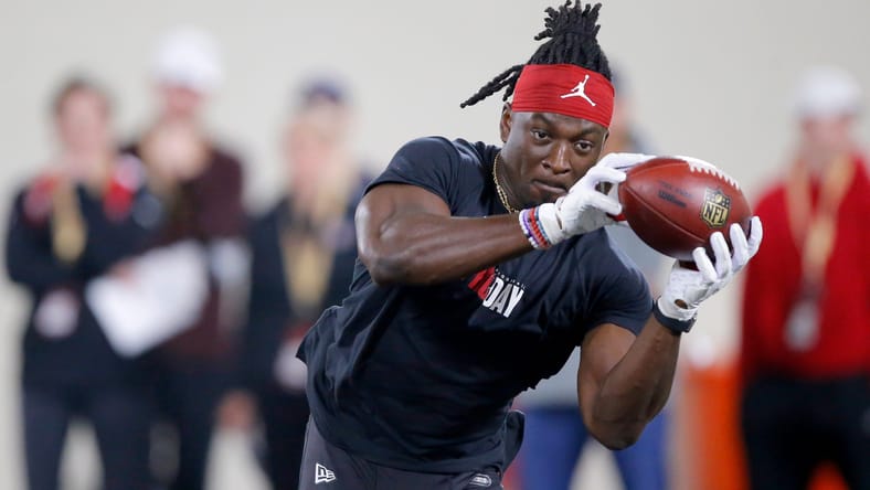 Brian Asamoah catches a pass during Oklahoma’s Pro Day workout at the Everest Training Center.