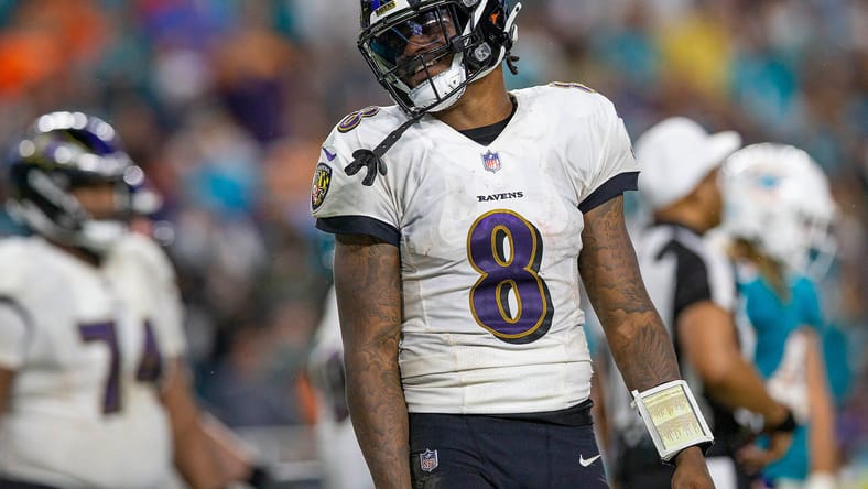 Ravens quarterback Lamar Jackson looking dejected on the field at Hard Rock Stadium. Vikings offseason dreams.