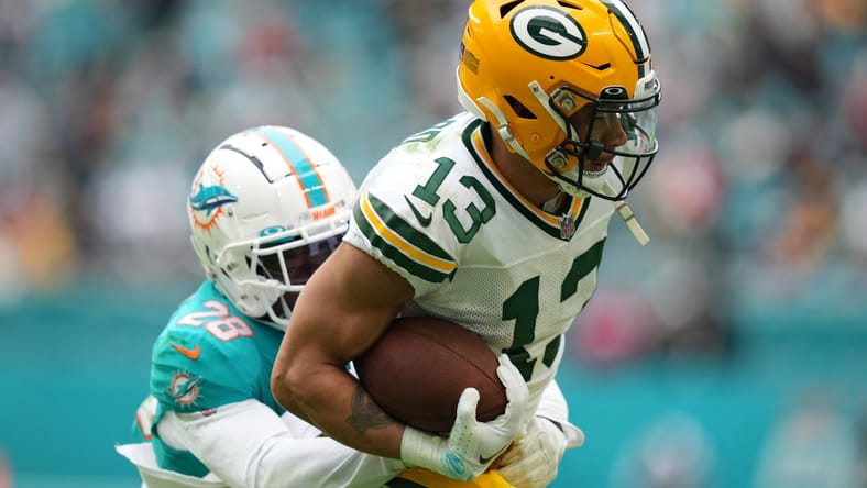 Allen Lazard tackled by Kader Kohou during Packers-Dolphins Christmas game.