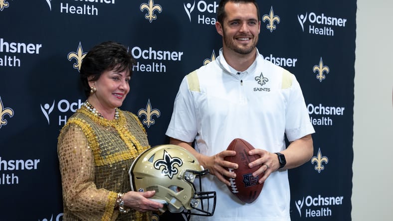 Gayle Benson poses with Derek Carr during his introduction with the Saints.