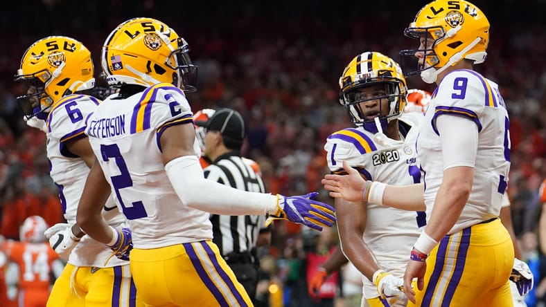 Joe Burrow and Vikings WR Justin Jefferson celebrate a touchdown in the 2020 national title game.