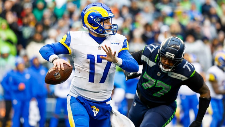 Baker Mayfield passes under pressure during the Rams-Seahawks game at Lumen Field. Mayfield could have been a Vikings QB option in 2023 free agency.