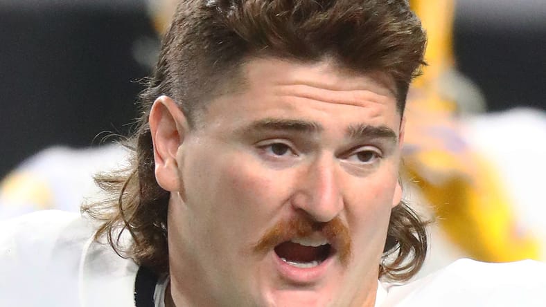 Dan Feeney leaving field after Chargers game in Miami.