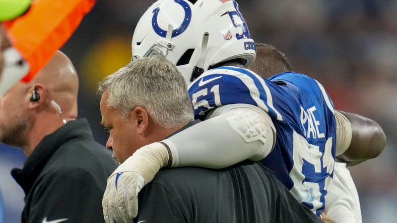 Colts defensive end Kwity Paye helped off after injury vs. Bears in 2024.
