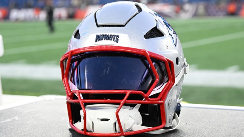 A New England Patriots helmet sits on an equipment case along the sideline after a game at Gillette Stadium. Jordan Addison trade