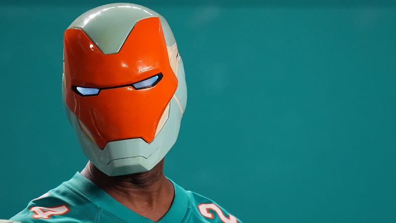A Miami Dolphins fan in 2024 watching a game featuring cornerback Jalen Ramsey.