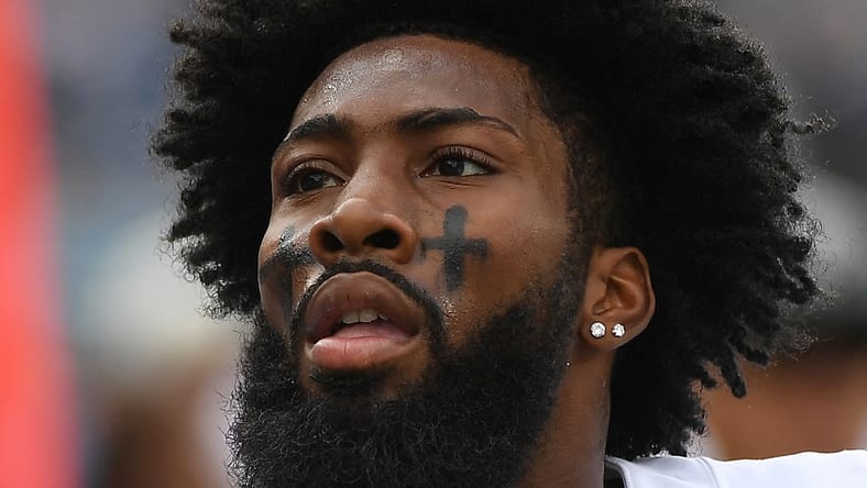 Las Vegas Raiders cornerback Nate Hobbs walks off the field after pregame warmups against the Tennessee Titans.
