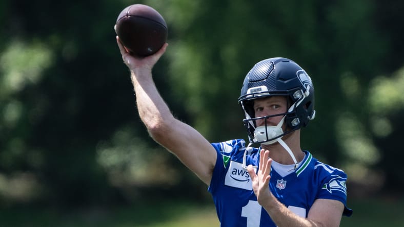 Sam Darnold passes to Drew Lock during Seahawks minicamp on June 11, 2025