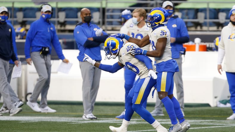 Jalen Ramsey celebrates after a pass breakup against DK Metcalf, fueling new Vikings rumors in 2025.