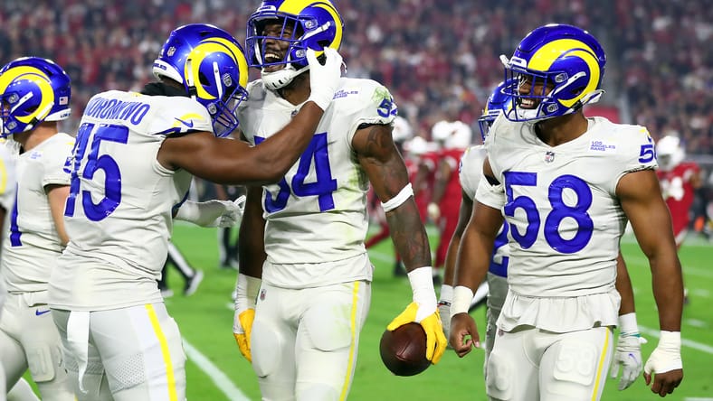 Rams linebackers celebrate an interception, including Obo Okoronkwo (45), during a 2021 game against the Cardinals.