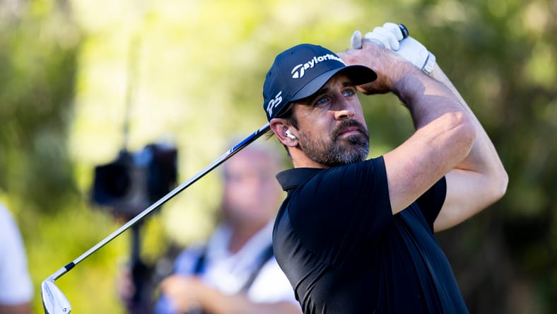 Aaron Rodgers watches his shot during Capital One's The Match at the Wynn Golf Club.