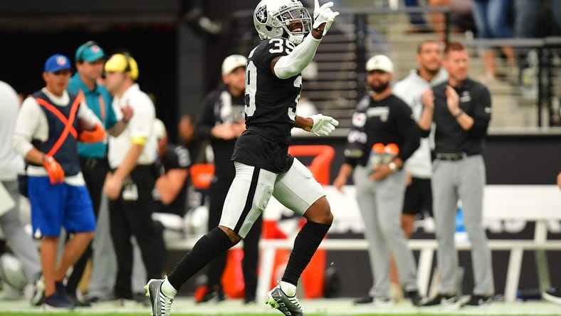 Raiders CB Nate Hobbs celebrates after sacking Broncos QB Russell Wilson in a home game at Allegiant Stadium