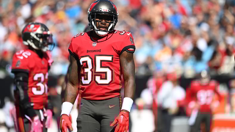 Jamel Dean stands on the field during a first-quarter snap in Charlotte.
