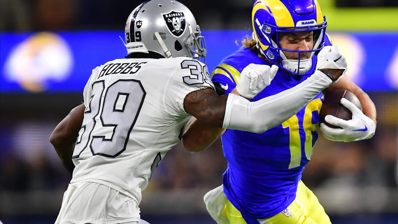 Raiders cornerback Nate Hobbs defends Rams WR Ben Skowronek on a run at SoFi Stadium.