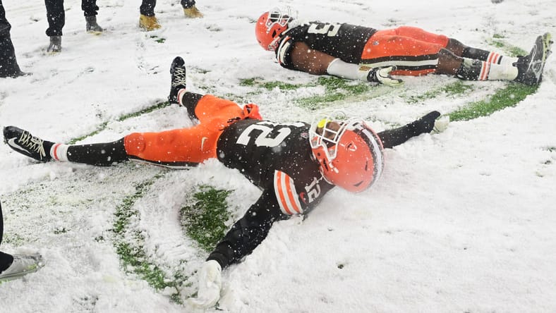 Browns defenders Ogbo Okoronkwo (54) and Rodney McLeod Jr. (12) celebrate a win over the Steelers on Nov. 21, 2024.