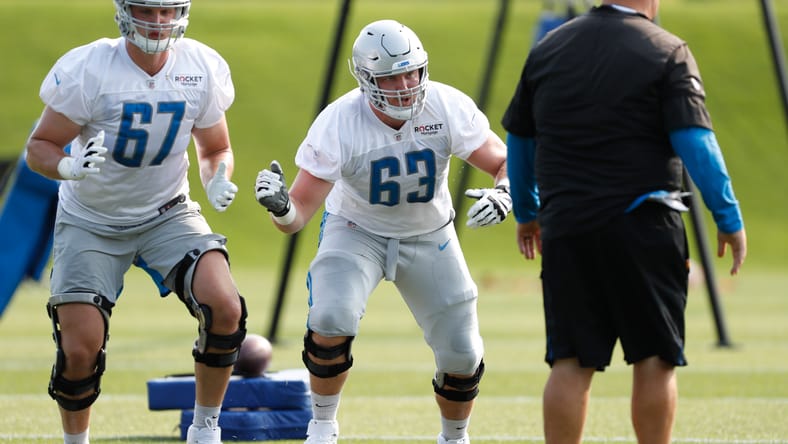 Matt Nelson and Beau Benzschawel run drills at Lions training camp.