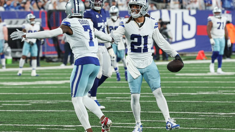 Gilmore and Diggs celebrate an interception during the first half vs. Giants.