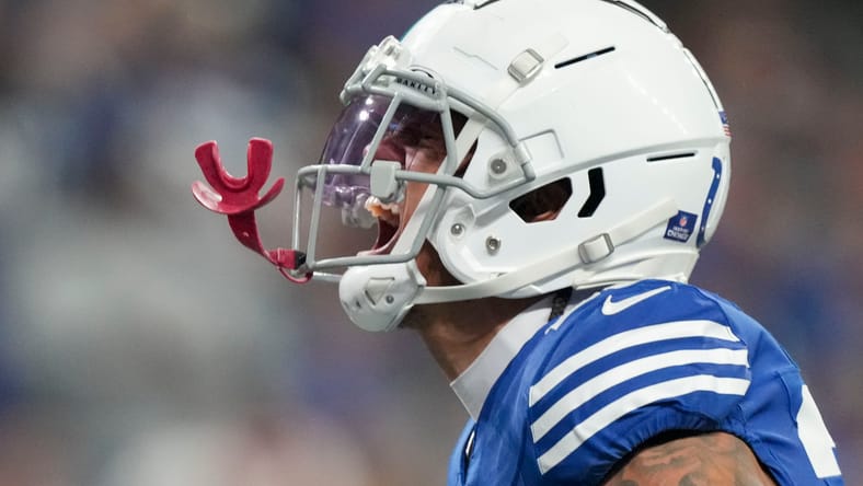 JuJu Brents reacts after stopping Najee Harris at the line of scrimmage during a game at Lucas Oil Stadium.
