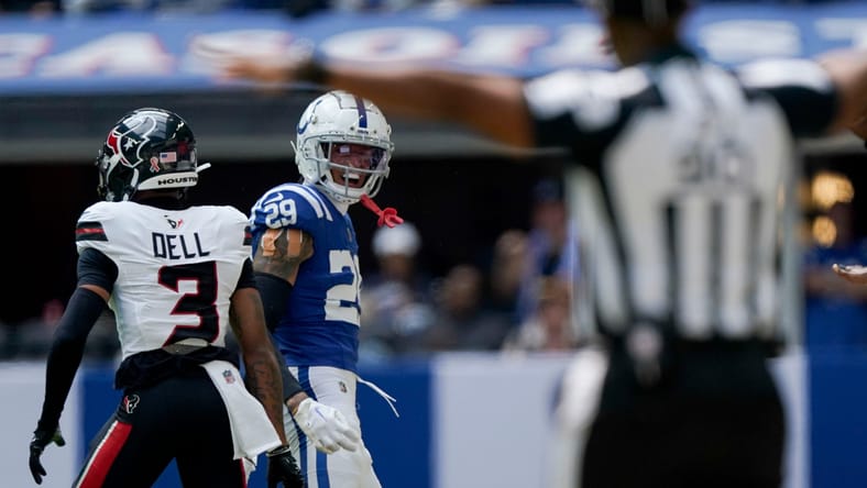 JuJu Brents defends a pass against Tank Dell in a Colts game; Brents is a potential Vikings trade candidate.