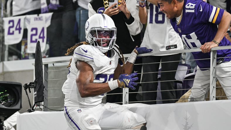 Aaron Jones celebrates a touchdown against the Bears at U.S. Bank Stadium.