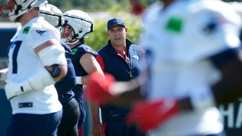 New Patriots head coach Mike Vrabel watches on at training camp.