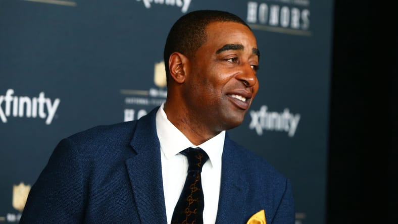 Cris Carter walks the red carpet before the 2015 NFL Honors ceremony.