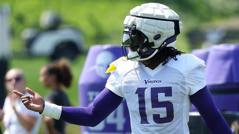 Dallas Turner takes part in linebacker drills at Vikings training camp.