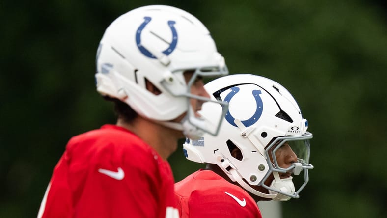 Anthony Richardson and Daniel Jones drop back during Colts camp drills.