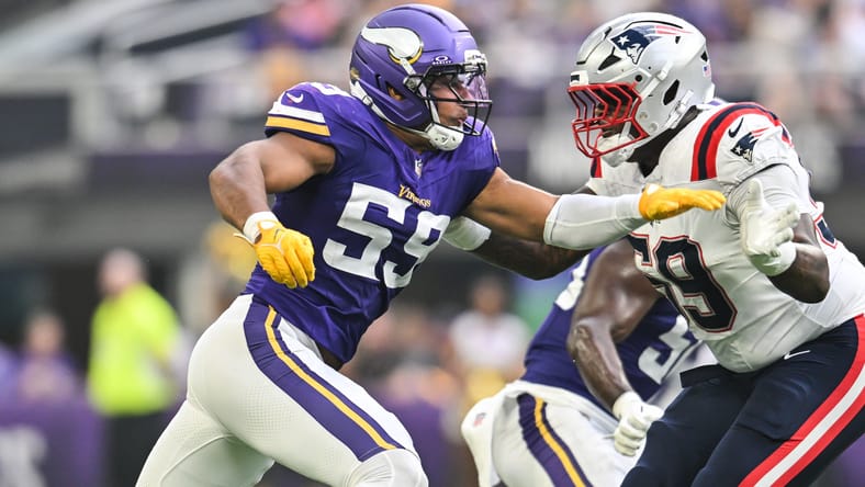 Vikings linebacker Gabriel Murphy rushes as Patriots tackle Vederian Lowe blocks at U.S. Bank Stadium.