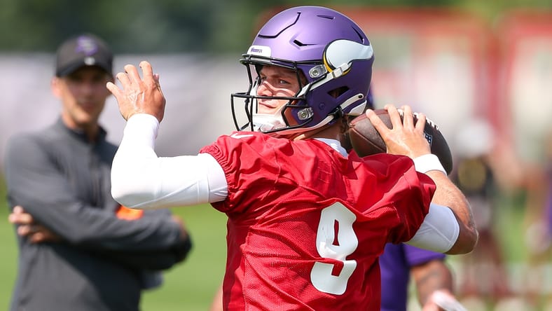 J.J. McCarthy throws during Vikings training camp in Eagan.