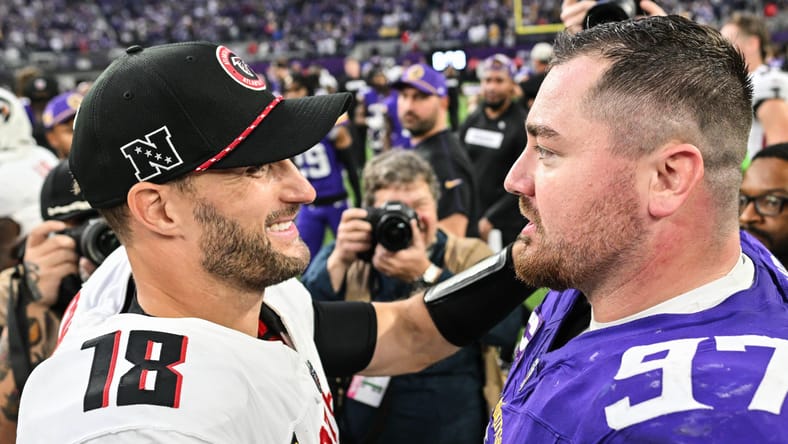 Kirk Cousins and Harrison Phillips, a Vikings DT, in 2024.