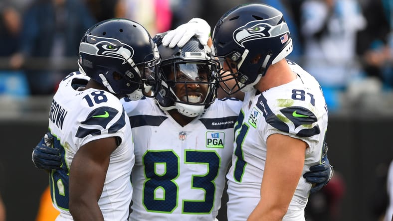 David Moore celebrates with Nick Vannett in 2018