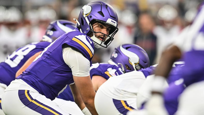 Sam Howell looks over the offense against the Patriots.