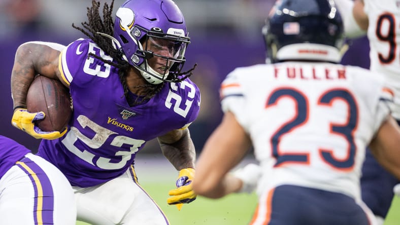 Mike Boone runs while defended by Kyle Fuller vs Bears.
