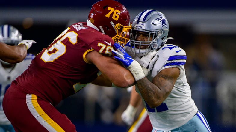 Sam Cosmi blocks Micah Parsons during Cowboys vs. Washington in 2021.