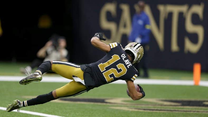Saints wide receiver Chris Olave dives for a touchdown against the Rams in 2022.