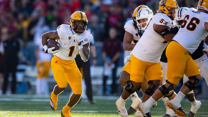 Xazavian Valladay carries the ball in the Territorial Cup against Arizona. Vallady became a member of the Vikings in 2025.