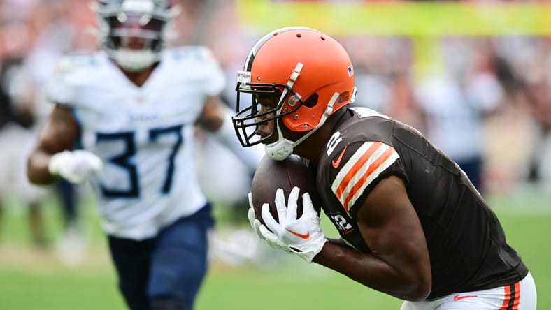 Amari Cooper catches a touchdown against the Titans in 2023.