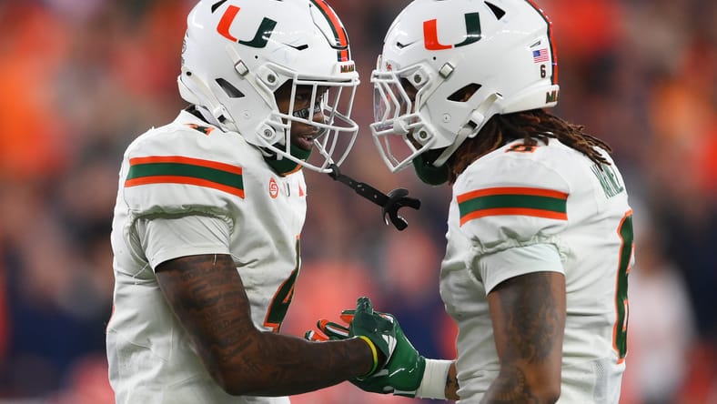 Damien Martinez celebrates with Mark Fletcher Jr. after a Miami touchdown.