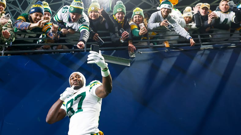 Romeo Doubs takes a selfie with Packers fans after beating the Seahawks. Doubs, in theory, could be a Vikings trade target in 2025. 