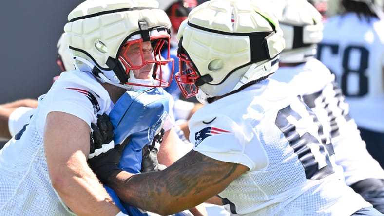 Garrett Bradbury and Layden Robinson run drill at Patriots training camp.