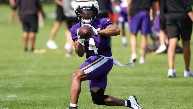 Rondale Moore takes part in Vikings training camp drills in Eagan.