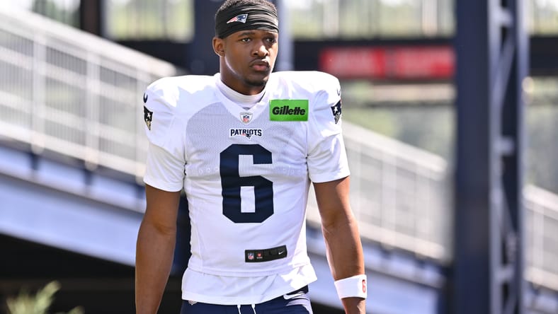 Patriots WR Javon Baker heads to training camp practice.