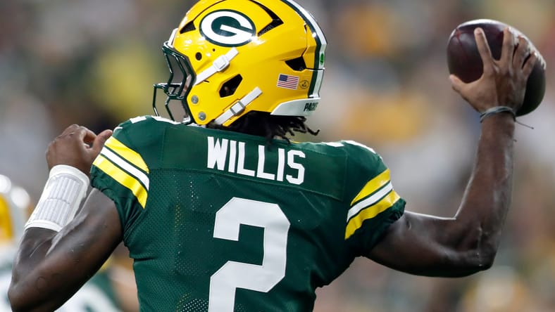 Packers quarterback Malik Willis lines up against the Jets at Lambeau Field