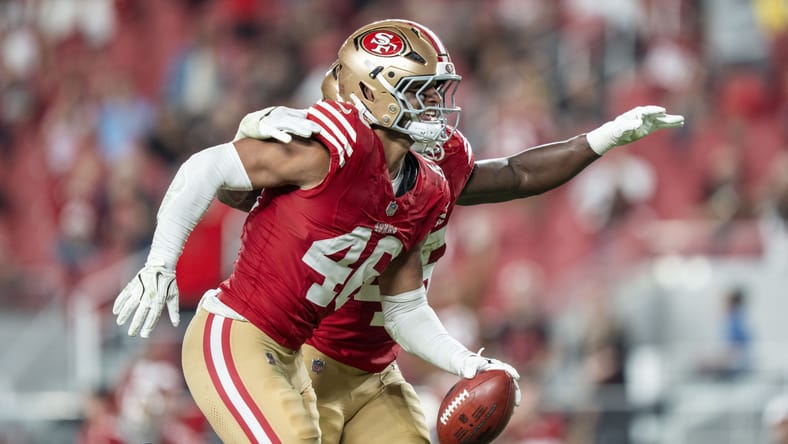 Chazz Surratt celebrates after recovering a fumble for the 49ers vs. Chargers.