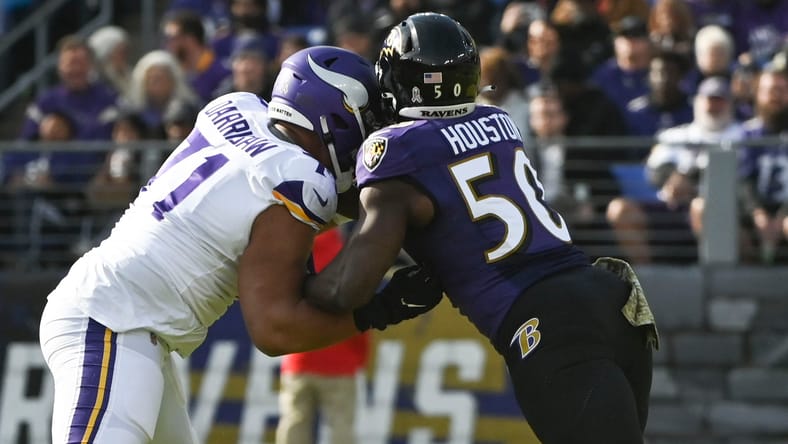 Kirk Cousins throws as Christian Darrisaw blocks Justin Houston during Vikings vs. Ravens at M&T Bank Stadium.