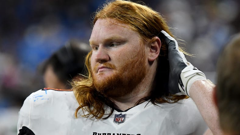Cody Mauch looks on before Buccaneers game in Detroit.