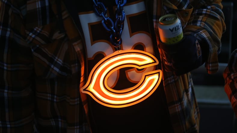 A Chicago Bears fan in 2024 with a necklace
