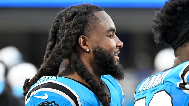 Patrick Jones II on sideline during Panthers game.