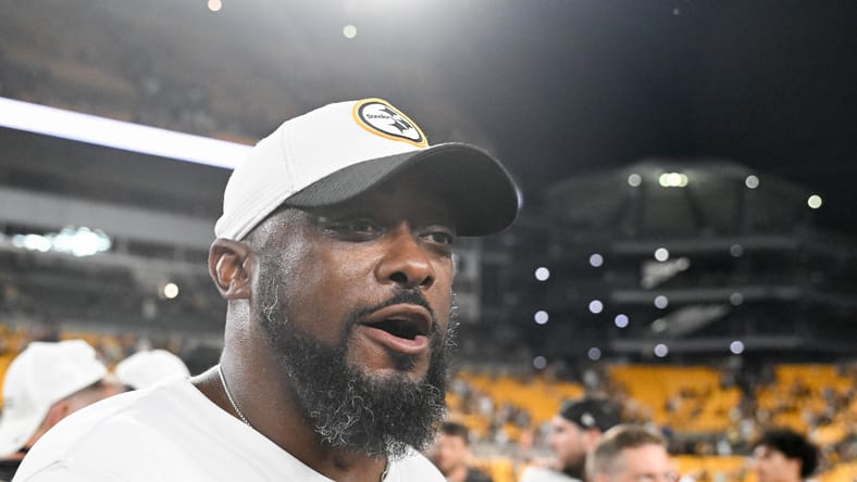 Mike Tomlin walks after Steelers preseason game against Buccaneers in 2025.